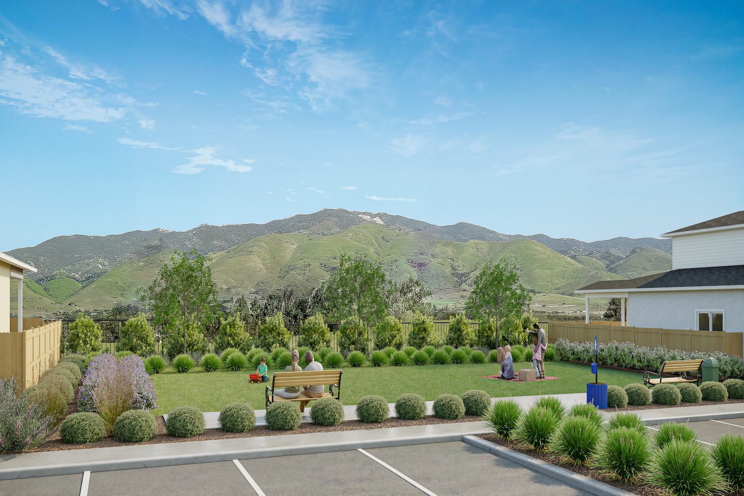 Community park at Hill Street Terraces with families enjoying a picnic, children playing soccer, and neighbors walking dogs.